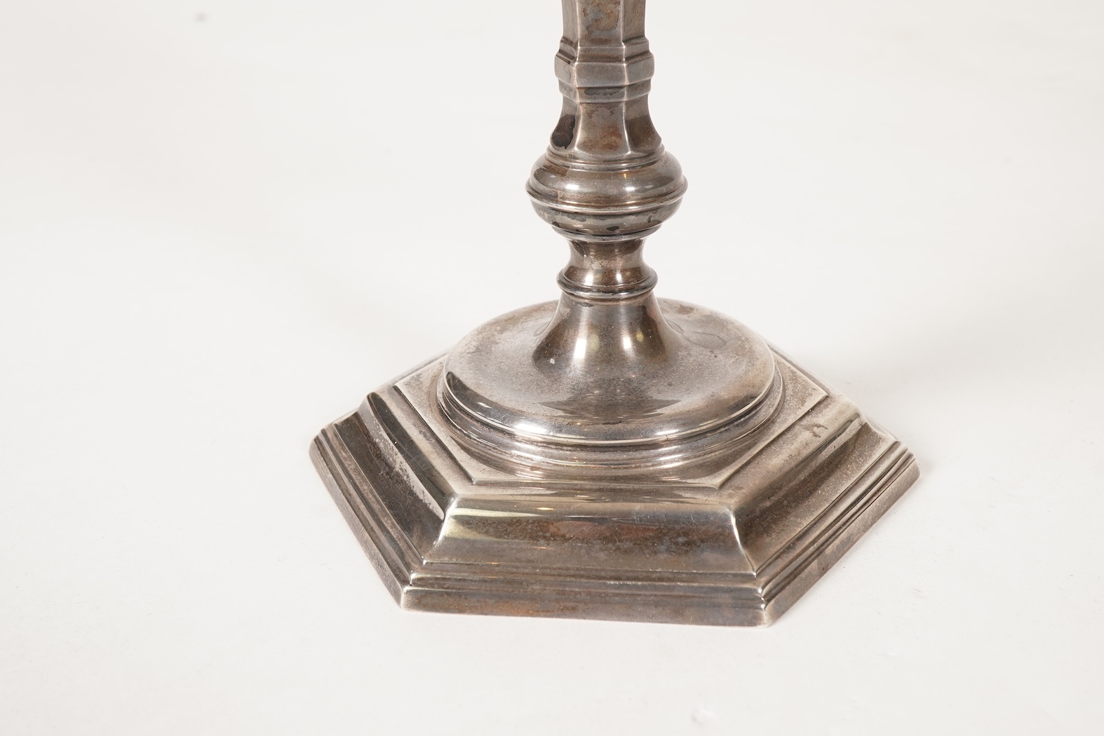 An Elizabeth II silver three branch, three light candelabrum, by William Comyns & Sons Ltd